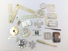 A quantity of mother of pearl buckles etc