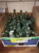 A box of vintage glass bottles