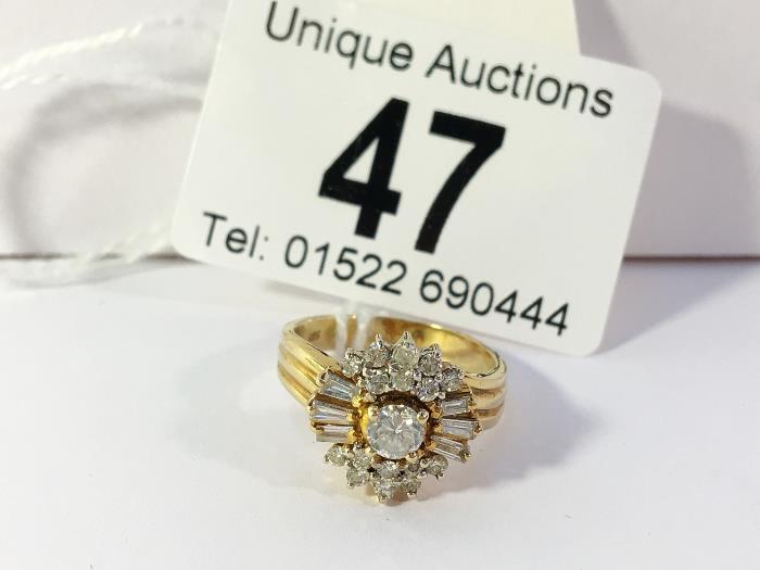 A high carat yellow gold ring of diamond baguettes and brilliants, size N, stamped 585