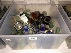 A box of vintage glass bottles