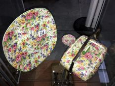 A chintz biscuit barrel, a chintz plate and a small pin tray