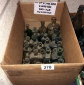 A box of assorted vintage bottles