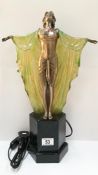 An art deco style figurine table lamp