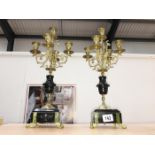 A pair of 5 branch gilded candelabra