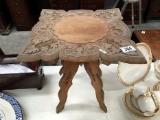 A small carved table