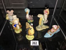 A collection of 7 Beatrix Potter figurines including Pickles, Sir Isaac Newton etc