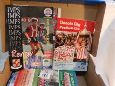 Approximately 50 Lincoln City football programmes including signed/autographed copies from 1980/90'