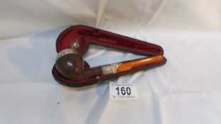 A cased silver mounted pipe