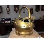 A brass coal scuttle