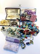 A mixed lot of costume jewellery including cased items, necklaces, cuff links etc