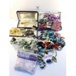 A mixed lot of costume jewellery including cased items, necklaces, cuff links etc