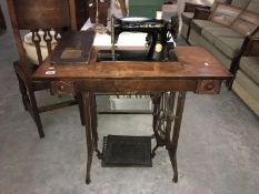 A Singer treadle sewing machine in table (complete)