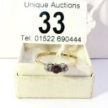 An 18ct gold amethyst and diamond 3 stone ring, size R