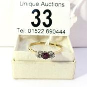 An 18ct gold amethyst and diamond 3 stone ring, size R