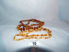 2 long yellow amber necklaces