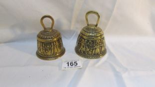 A pair of 19th century embossed brass bells