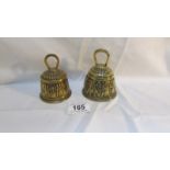 A pair of 19th century embossed brass bells