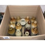 A box of vintage stone ware bottles