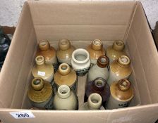 A box of vintage stone ware bottles