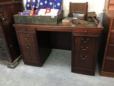 A mahogany double pedestal knee hole desk