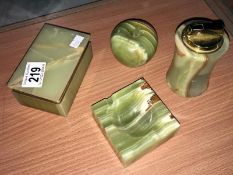 An onyx cigarette box, onyx lighter and 2 other onyx items