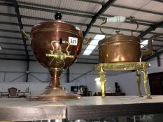 A copper samovar, a copper kettle and a brass trivet