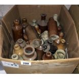 A box of vintage stone ware bottles