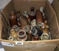 A box of vintage stone ware bottles