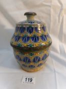 A hand painted lidded pot