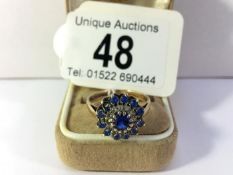 A gold cluster ring, missing one stone