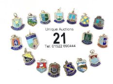 17 silver and enamel charms of English towns