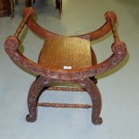 19thC Oak x-framed stool, with turned top rails, carved front panels.