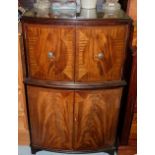 Mahogany Bow-front 4-door Drinks Cabinet, the top two doors opening to satinwood interior, with