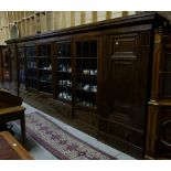 Large German Oak Bookcase, with two cupboard doors enclosing shelves on either end, with 5 x