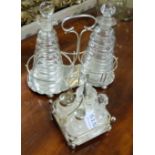 4 piece low sized cut glass condiment set in plated stand & 2 circular Victorian vinegar bottles