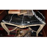 French Coffee Table, the shaped black marble top over a cream painted base, 40”w