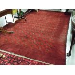 Red Afghan Bacara Floor Rug, red ground, with small central medallion designs, 2.1m x 3m