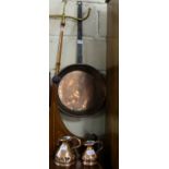 Pair of graduating copper measures and copper frying pan