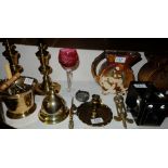 Shelf of items – brass counter bell, candlesticks, pair vases, old camera etc