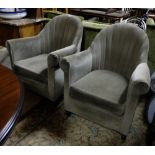 Matching pair Art Deco Style Armchairs, with green velour fabric, on turned legs and castors.