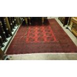 Hand Made Afghan Rug, Baccara Pattern, red ground with blue designs. 198cm x 281cm
