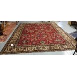 Large red ground Persian Tabriz Carpet, with all over design, 365cm x 294cm
