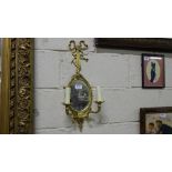 Matching Pair of Brass Framed Wall Lights, the ribbon-shaped pediments over oval mirrors, with 2