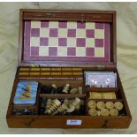 Mahogany Cased Games Box, with chess board, wooden chess and draughts pieces, dominos etc