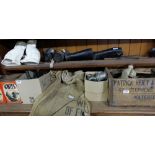 Two Shelves – carbide lamps, canvas sacks, gas masks, small metal tools in adv. Crate etc