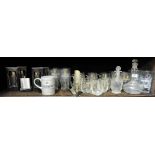 Shelf of bar related glassware – Guinness pint tumblers and glasses & 4 glass decanters on top