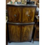 Mahogany Bow-front 4-door Drinks Cabinet, the top two doors opening to satinwood interior, with