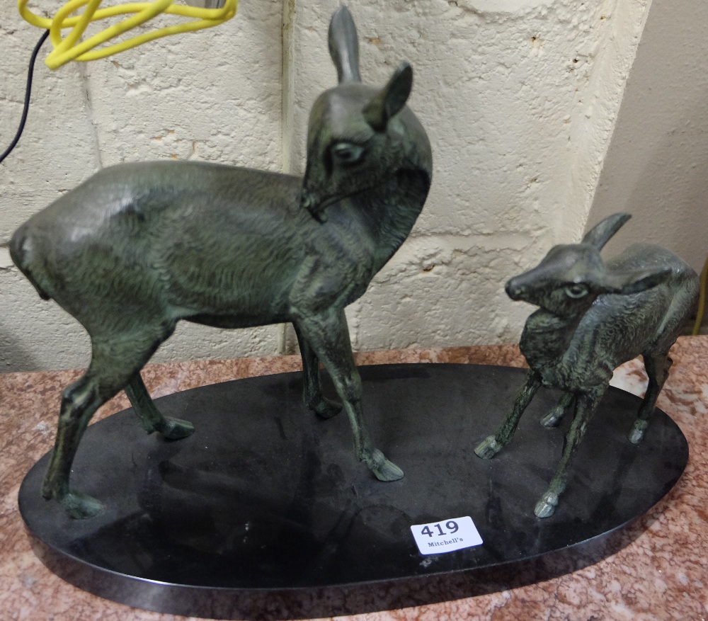 Early 20thC French Bronze Group – a grooming doe with her fawn, on an oval black marble base, 18”w x