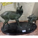 Early 20thC French Bronze Group – a grooming doe with her fawn, on an oval black marble base, 18”w x