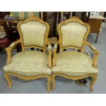 Matching Pair of Carved Walnut Armchairs, the seats and backs covered with satin musical patterned